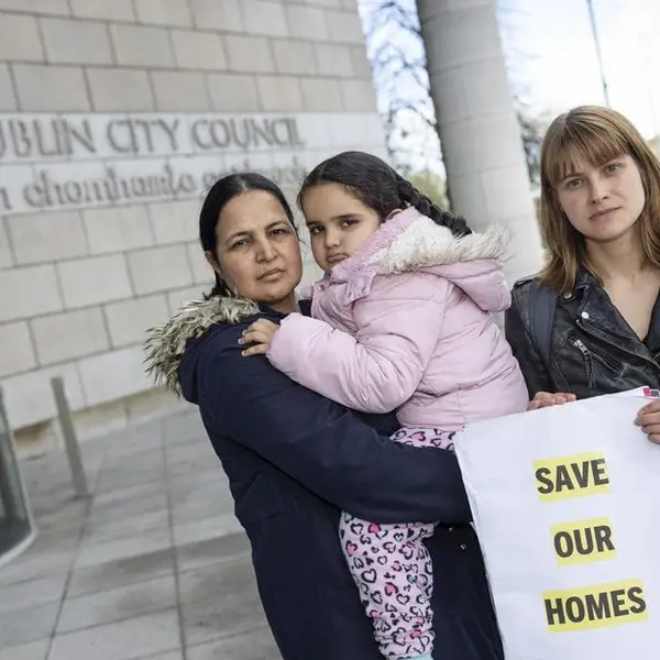 Madeleine Johansson standing with other tenants of Tathony House opposing mass eviction