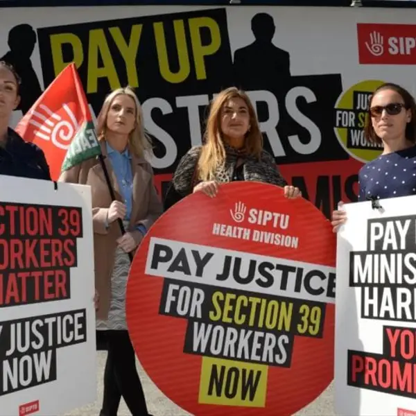 Section 39 workers holding placards