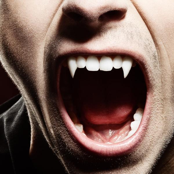 Vampire with mouth open fangs showing